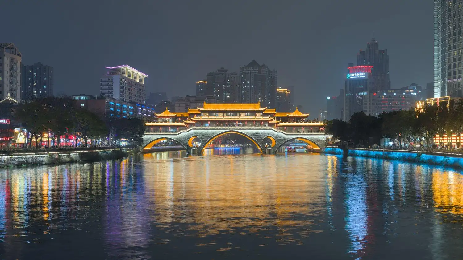 Anshun Bridge in Chengdu illuminated at night with reflections on the Jin River
